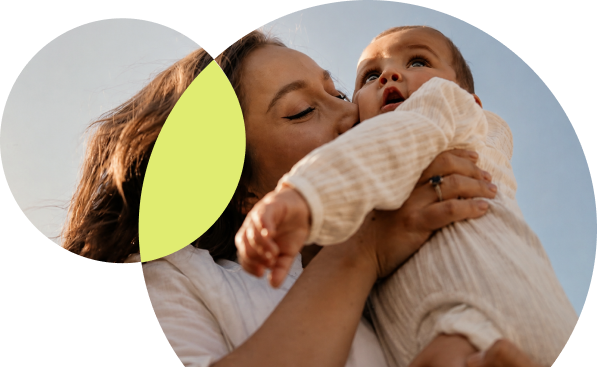 Mother kissing baby